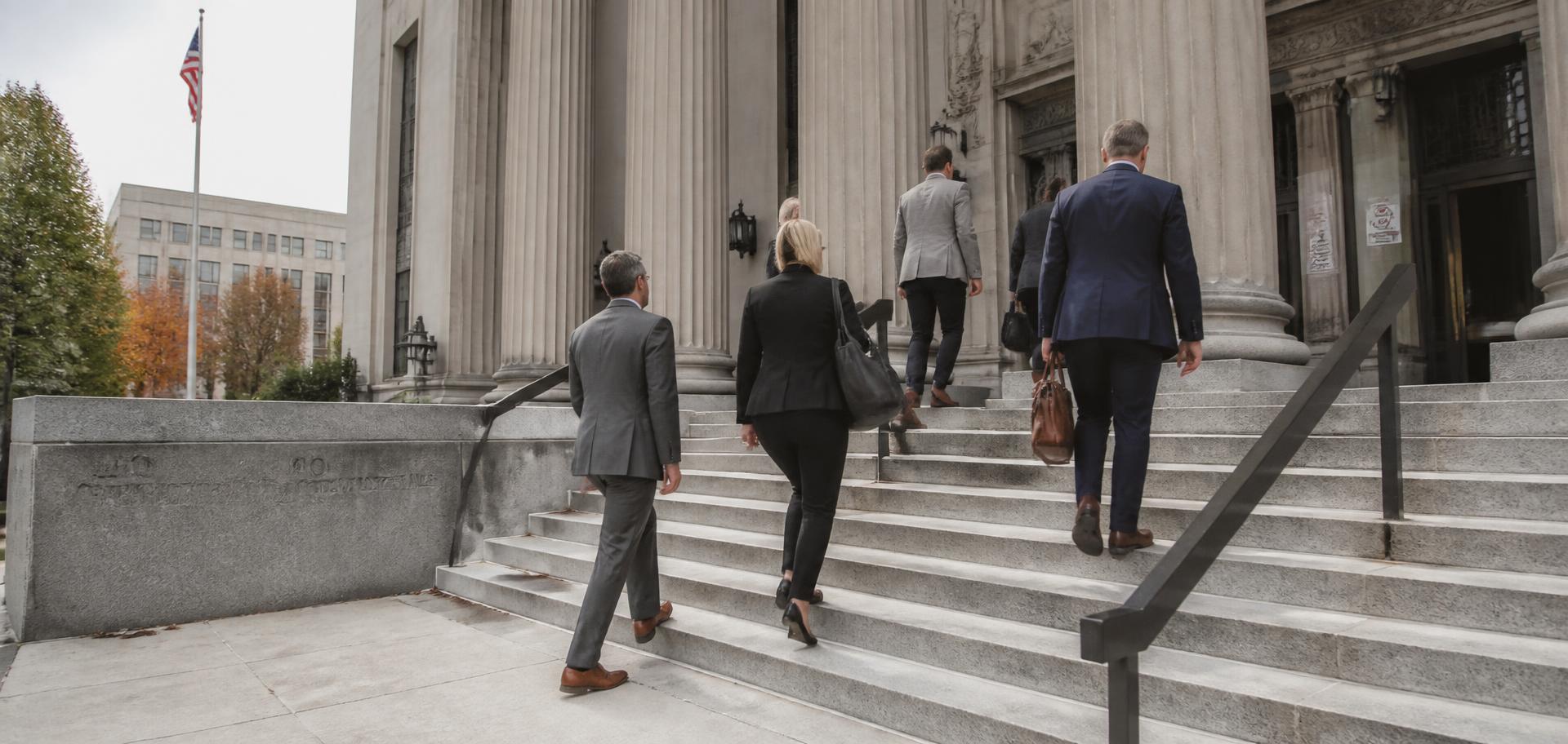 Attorneys walking up courthouse steps